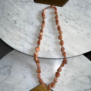 Artisnal 26" peach/pink natural stone necklace.